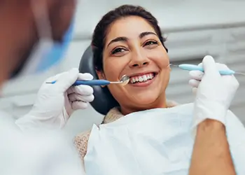 Woman smiling at her dentist right before treatment