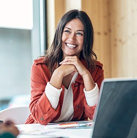 Woman smiling during meeting in office
