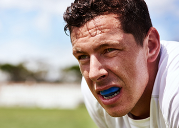 Athlete wearing a blue mouthguard