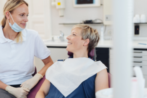 a patient discussing dental implants with their dentist 